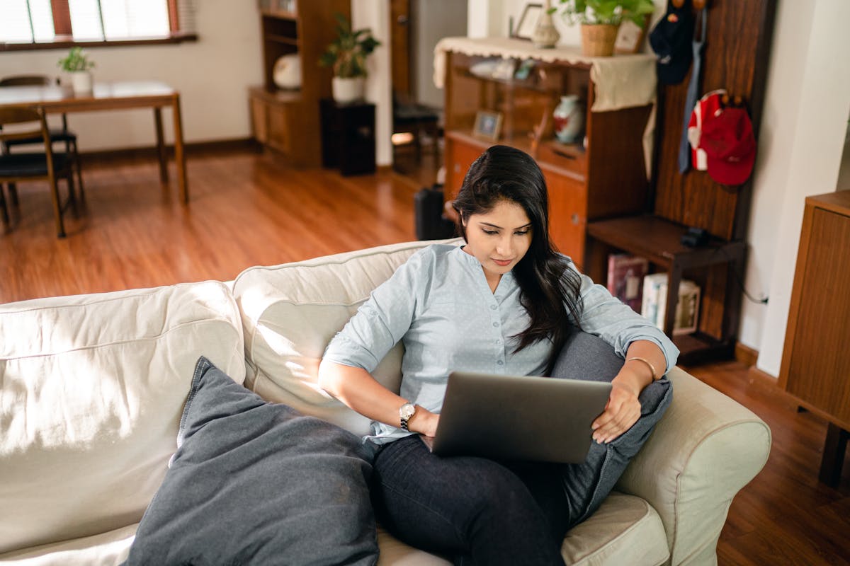 Indian woman working on a laptop at home